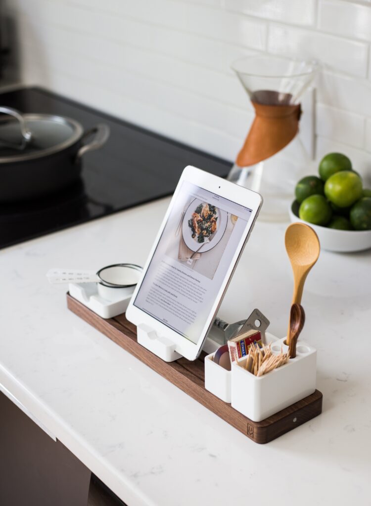 kitchen utensils and ipad showing a recipe