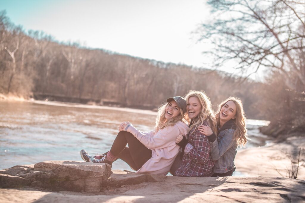 3 women by a lake