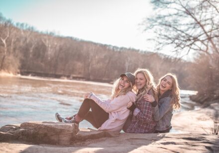 3 women by a lake